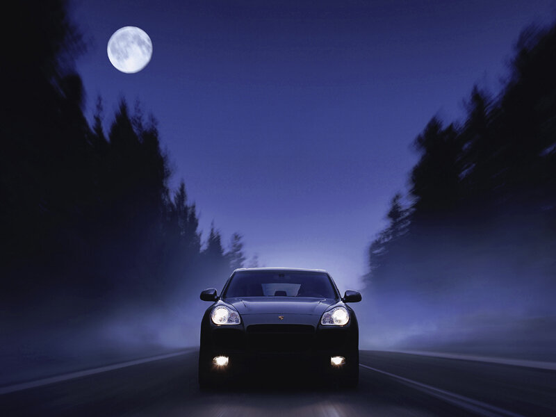 Porsche on a moonlit road