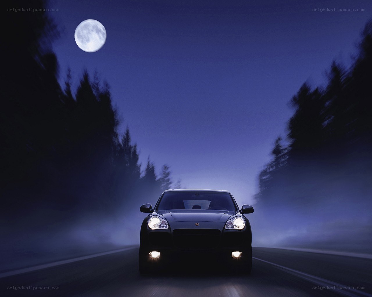 Porsche on a moonlit road