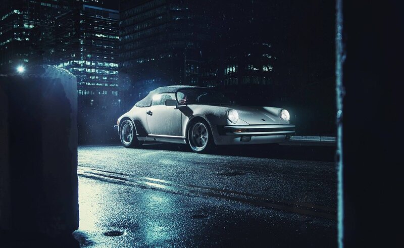 Porsche on a rainy city street