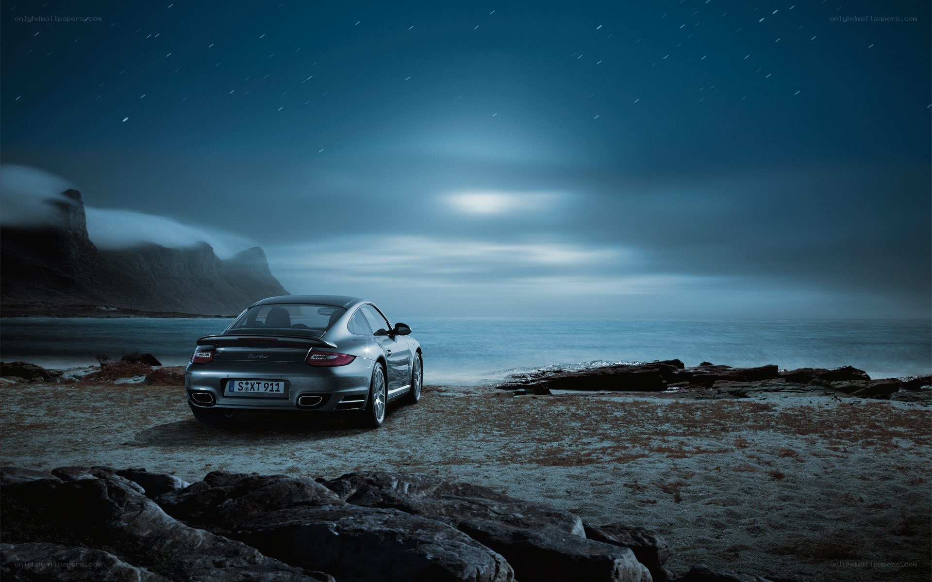Porsche on a rocky beach