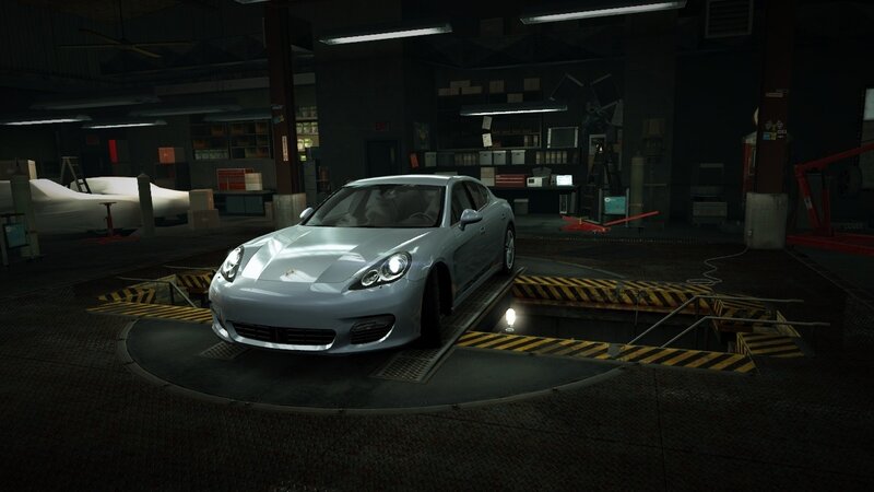 Porsche on a turntable in garage