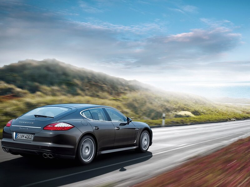 Porsche Panamera driving on coastal road