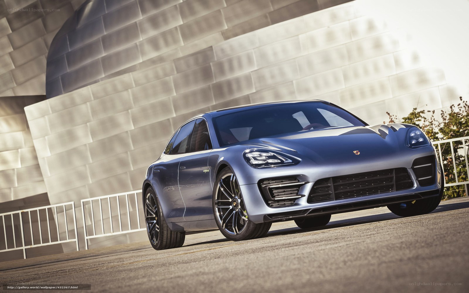Porsche Panamera in front of modern building