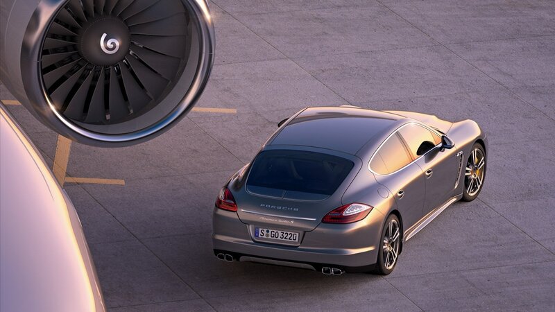 Porsche Panamera Turbo S near aircraft