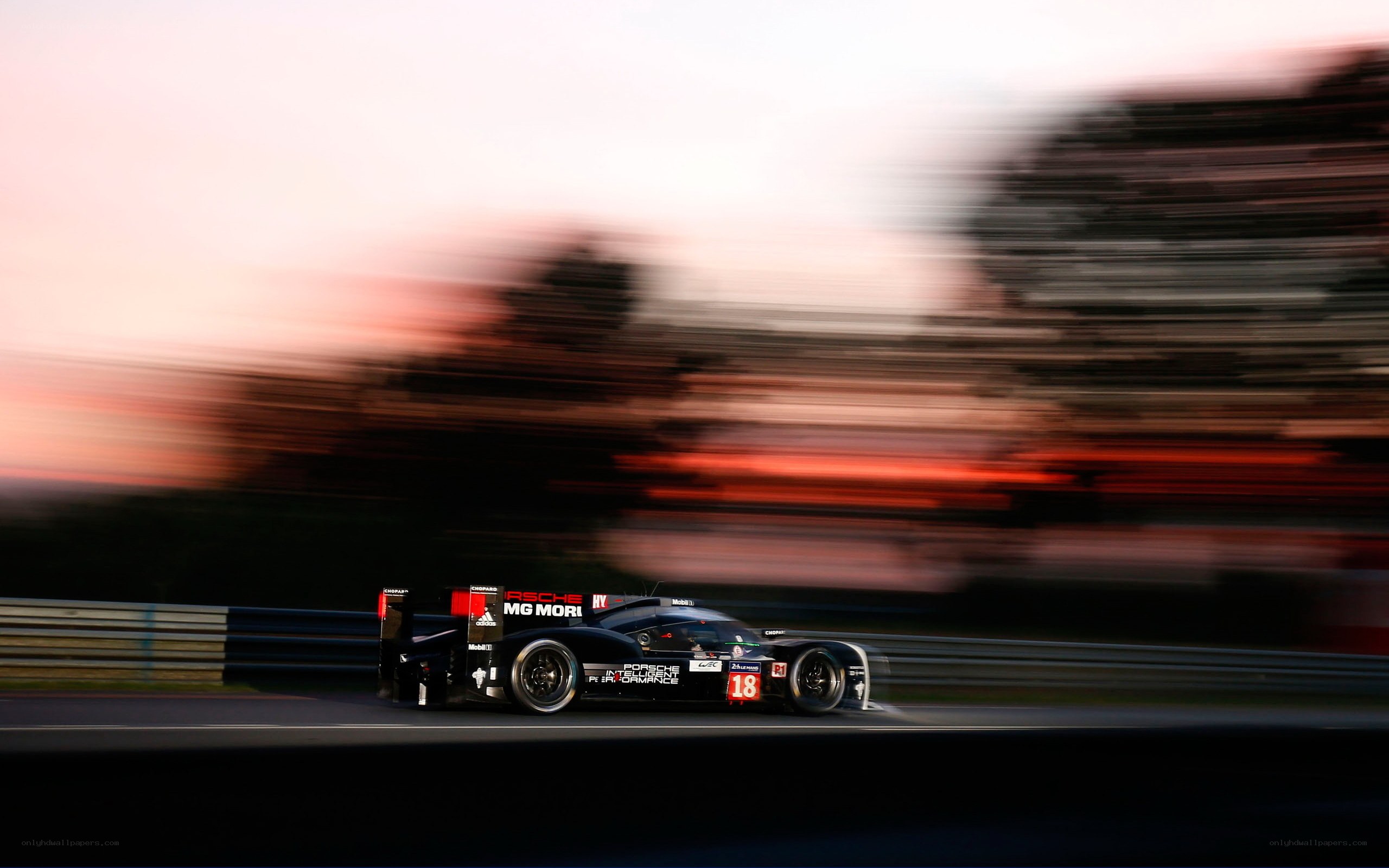 Porsche race car at dusk