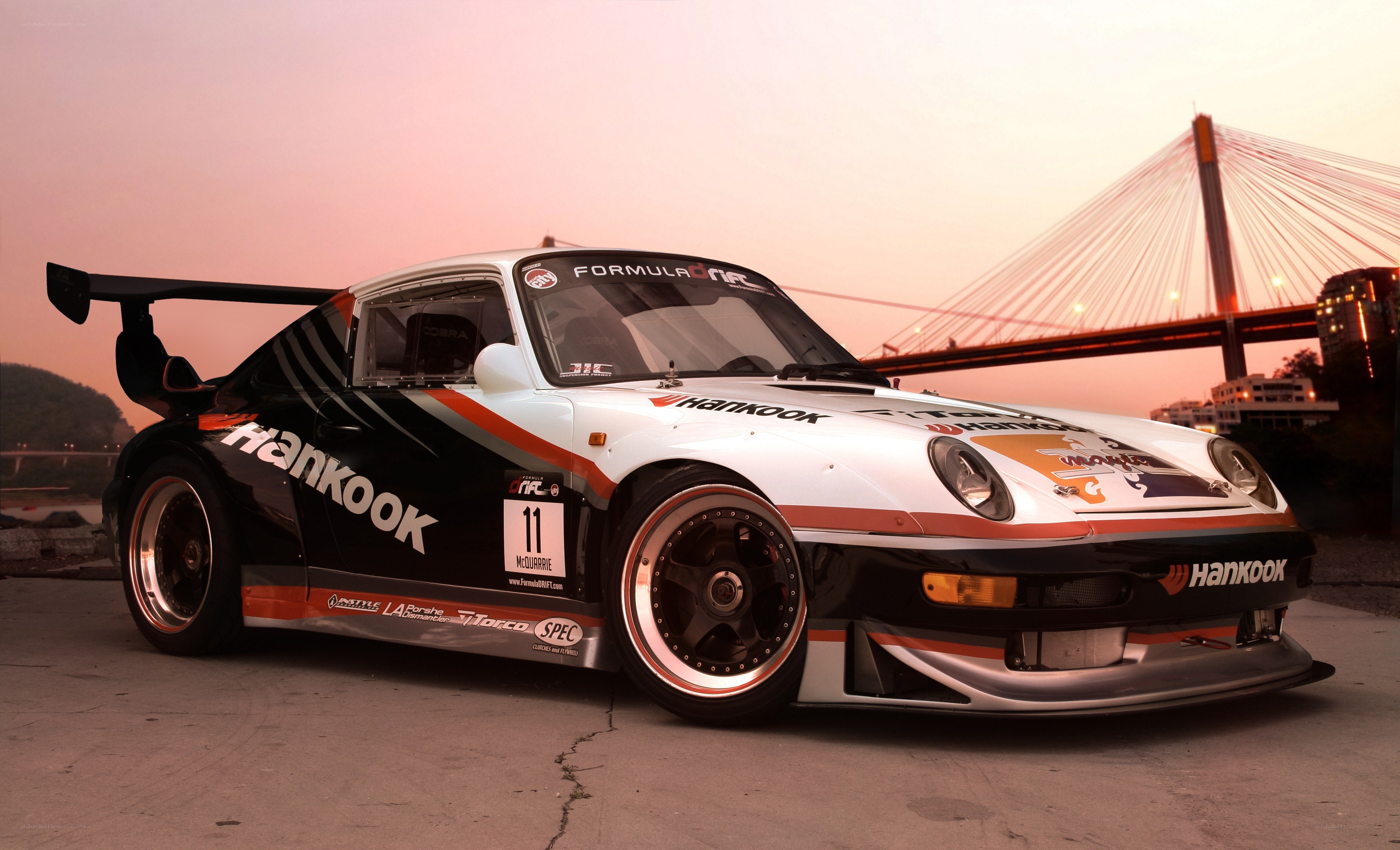 Porsche race car at sunset
