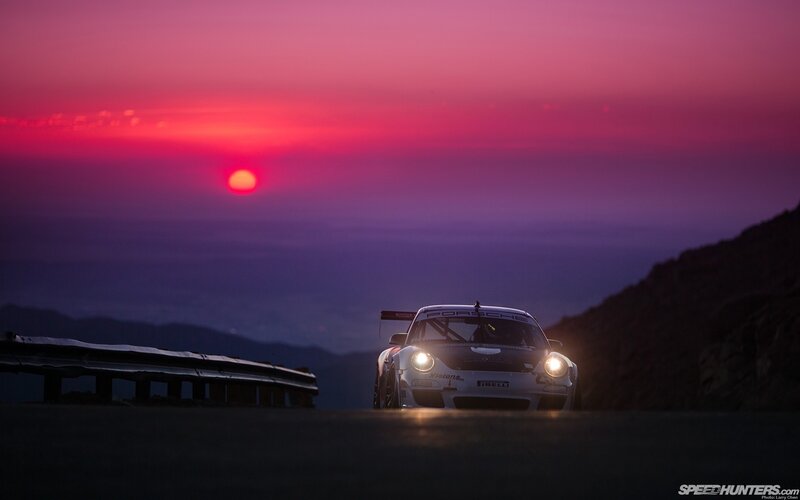 Porsche race car at sunset