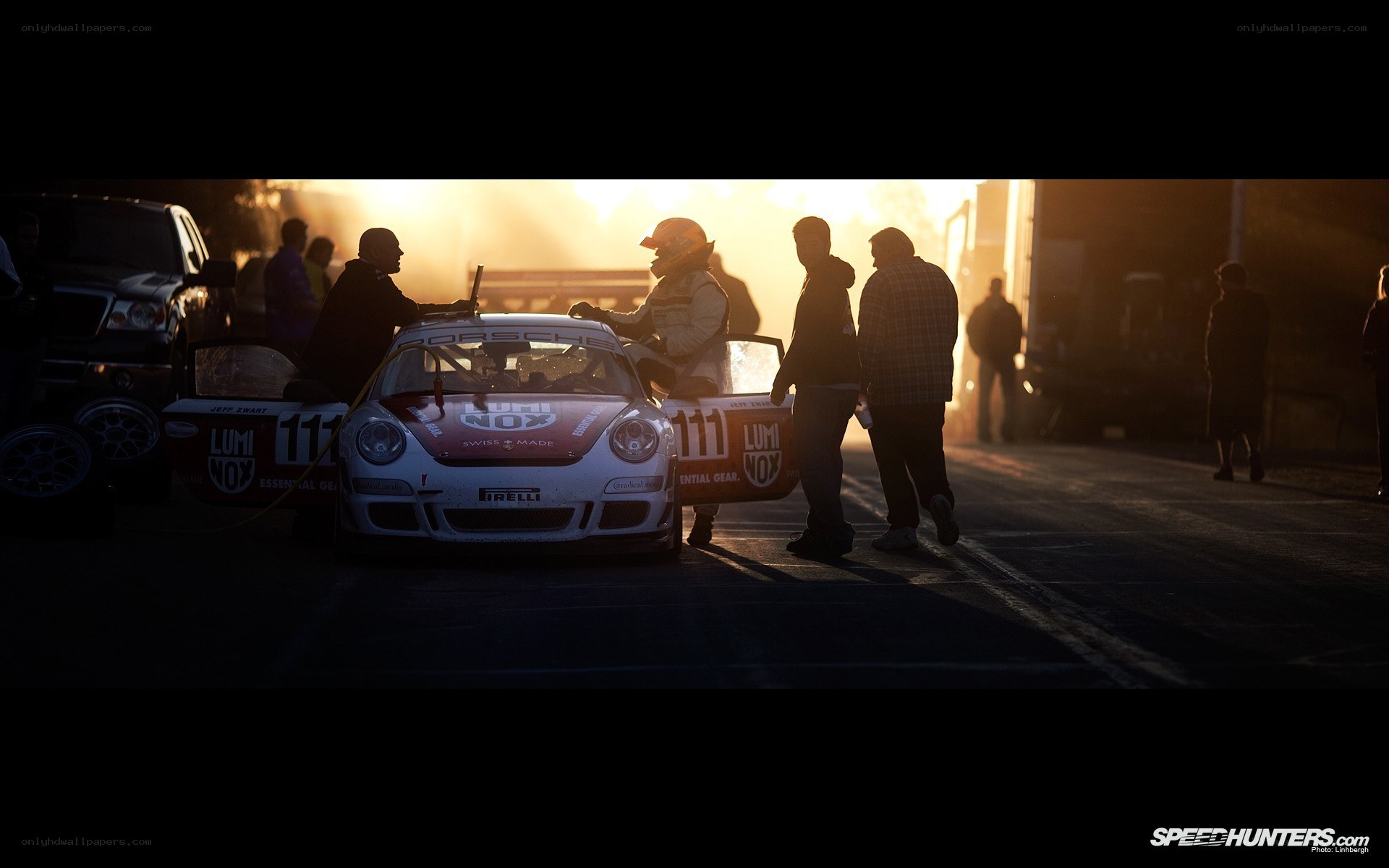 Porsche race car at sunset