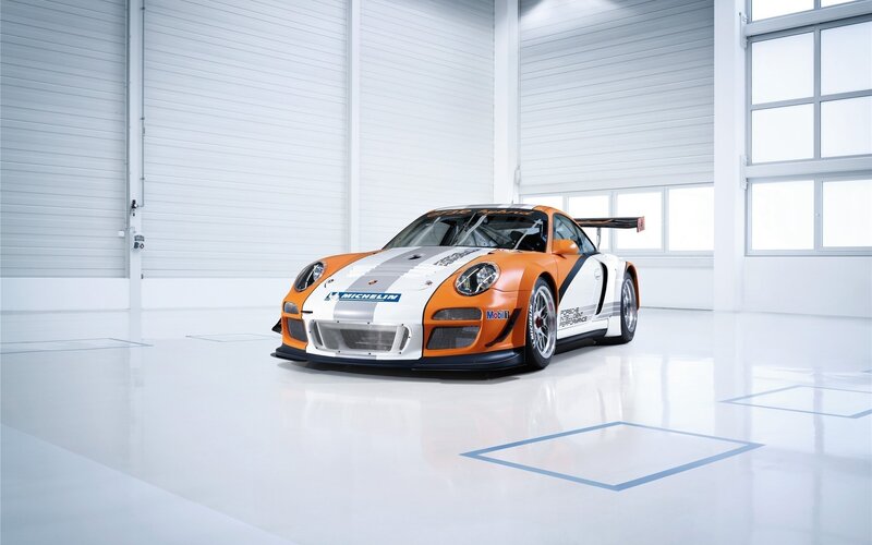 Porsche race car in garage