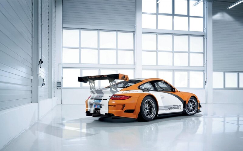 Porsche race car in garage
