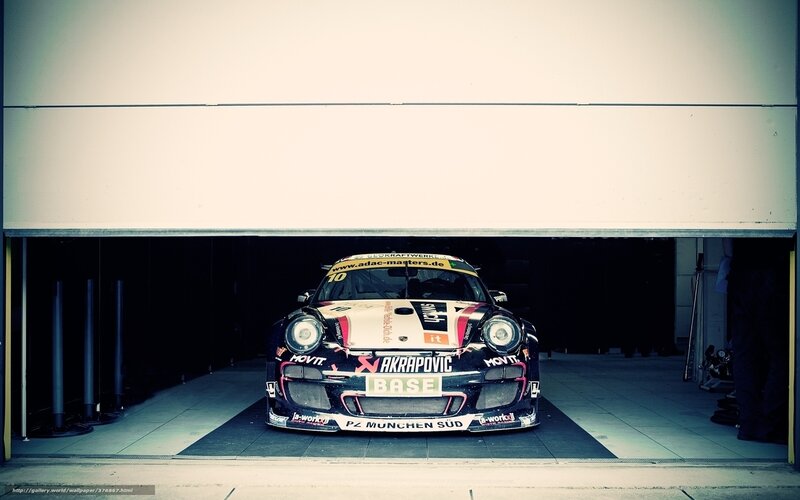 Porsche race car in garage
