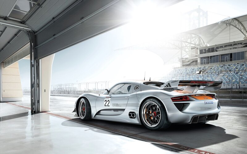 Porsche race car in pit lane