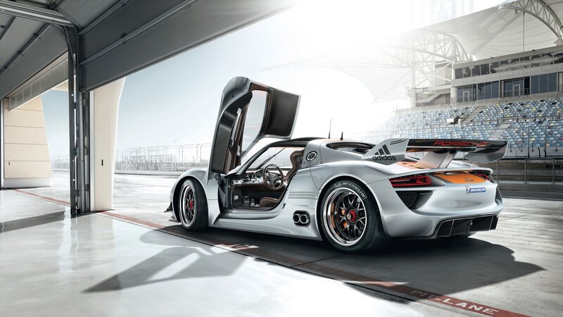 Porsche race car in pit lane