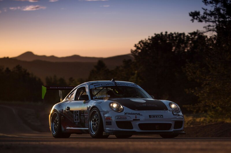 Porsche race car on a mountain road