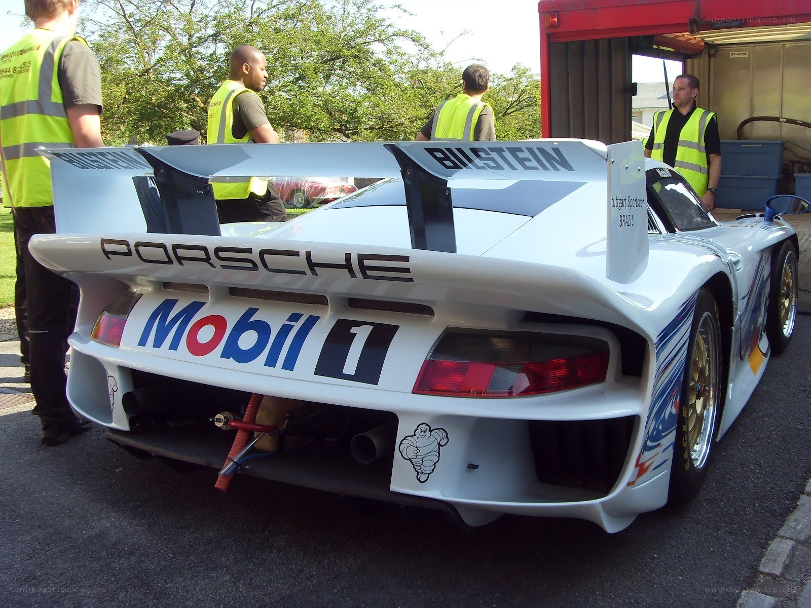 Porsche race car with crew