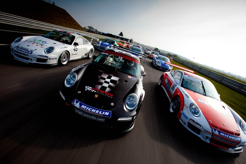 Porsche race cars on track