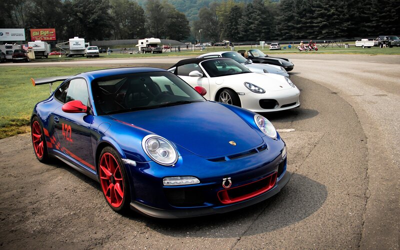 Porsche race cars on track