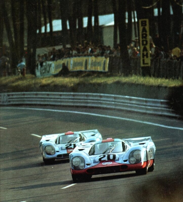 Porsche race cars on track