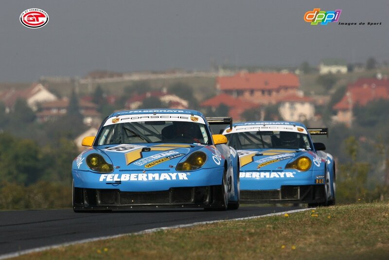 Porsche race cars on track