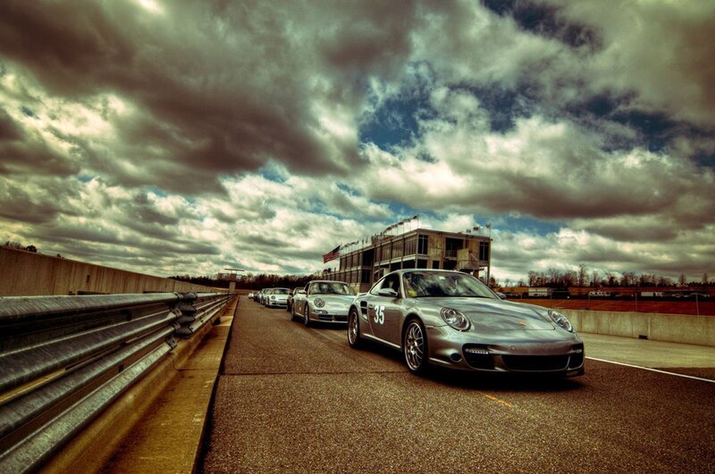Porsche race cars on track