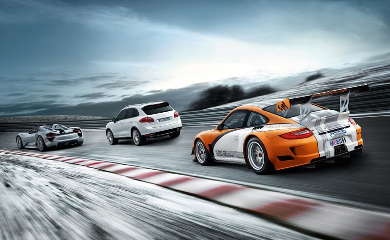 Porsche Race Cars on Track — Orange