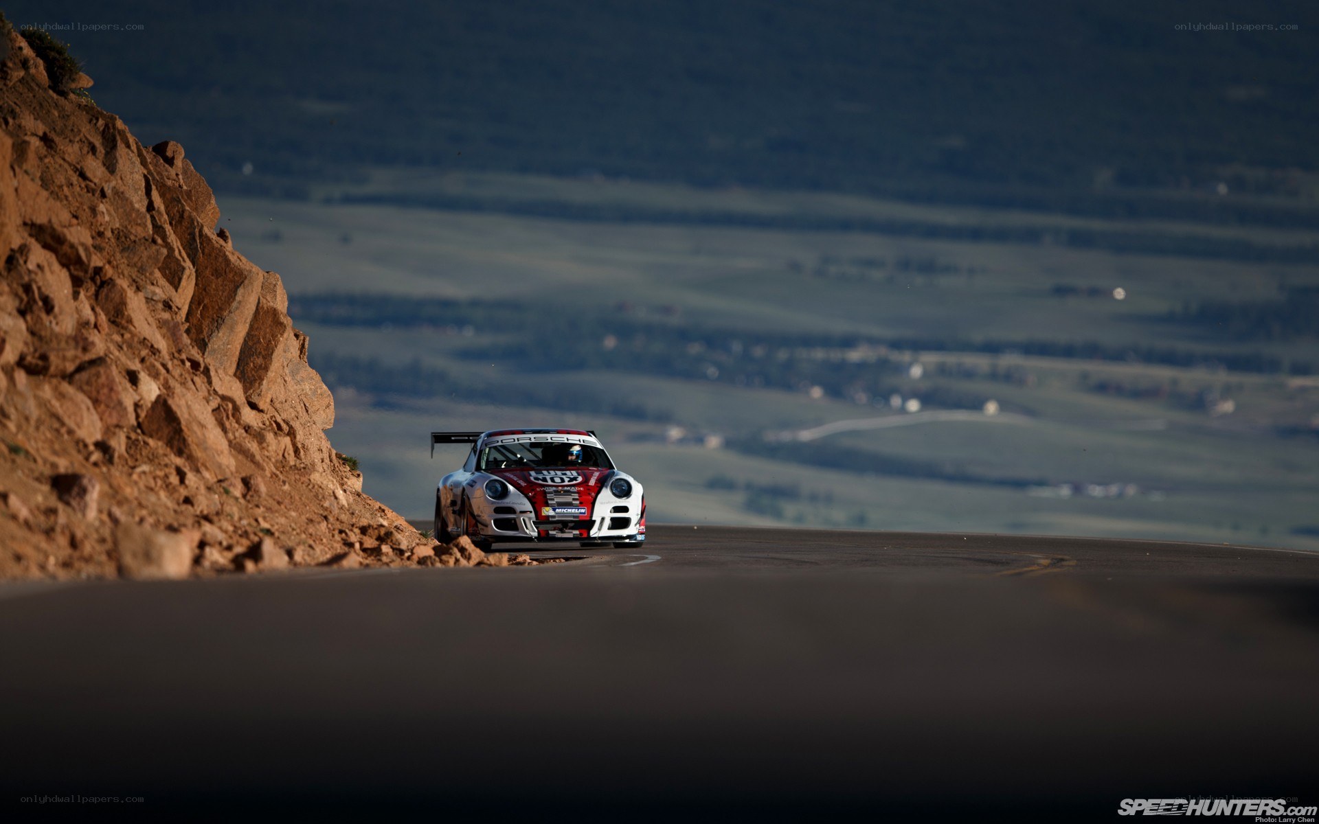 Porsche racing on a mountain road