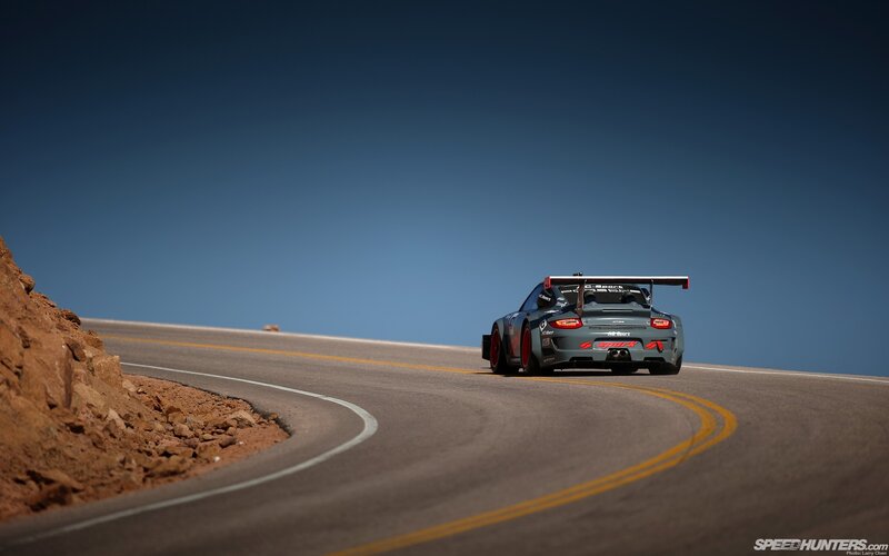 Porsche racing on a mountain road