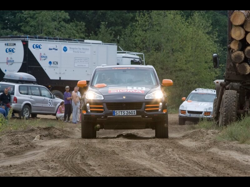 Porsche rally car on dirt track