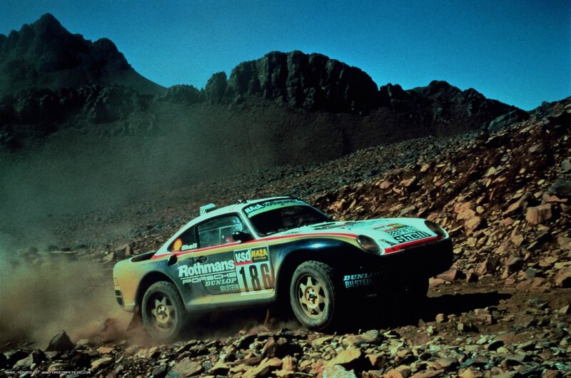 Porsche rally car on rocky terrain