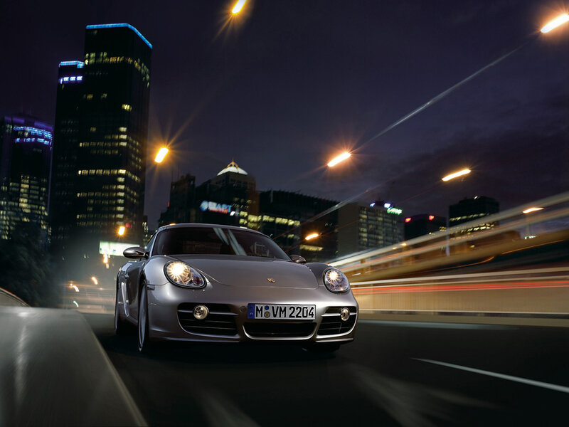 Porsche sports car at night in city