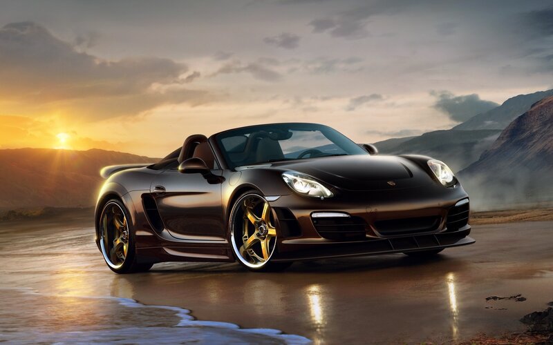 Porsche sports car at sunset