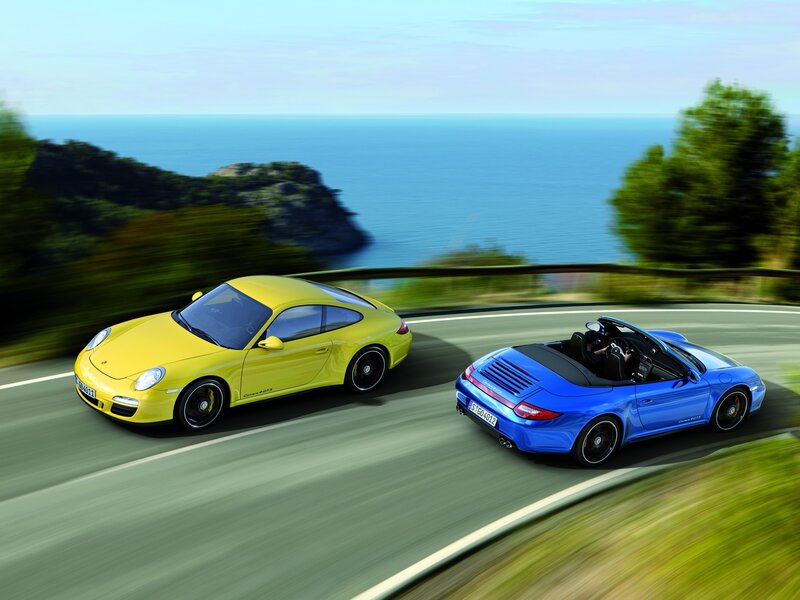 Porsche sports cars on coastal road