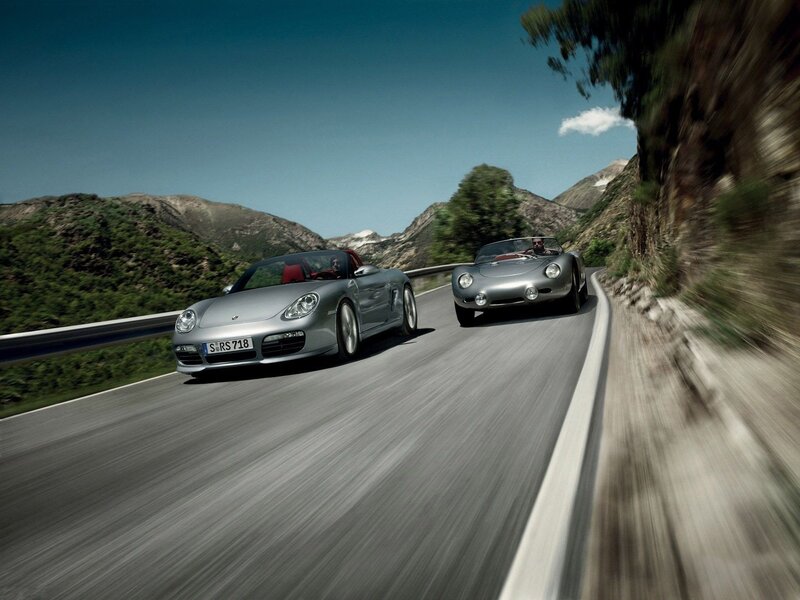 Porsche sports cars on mountain road