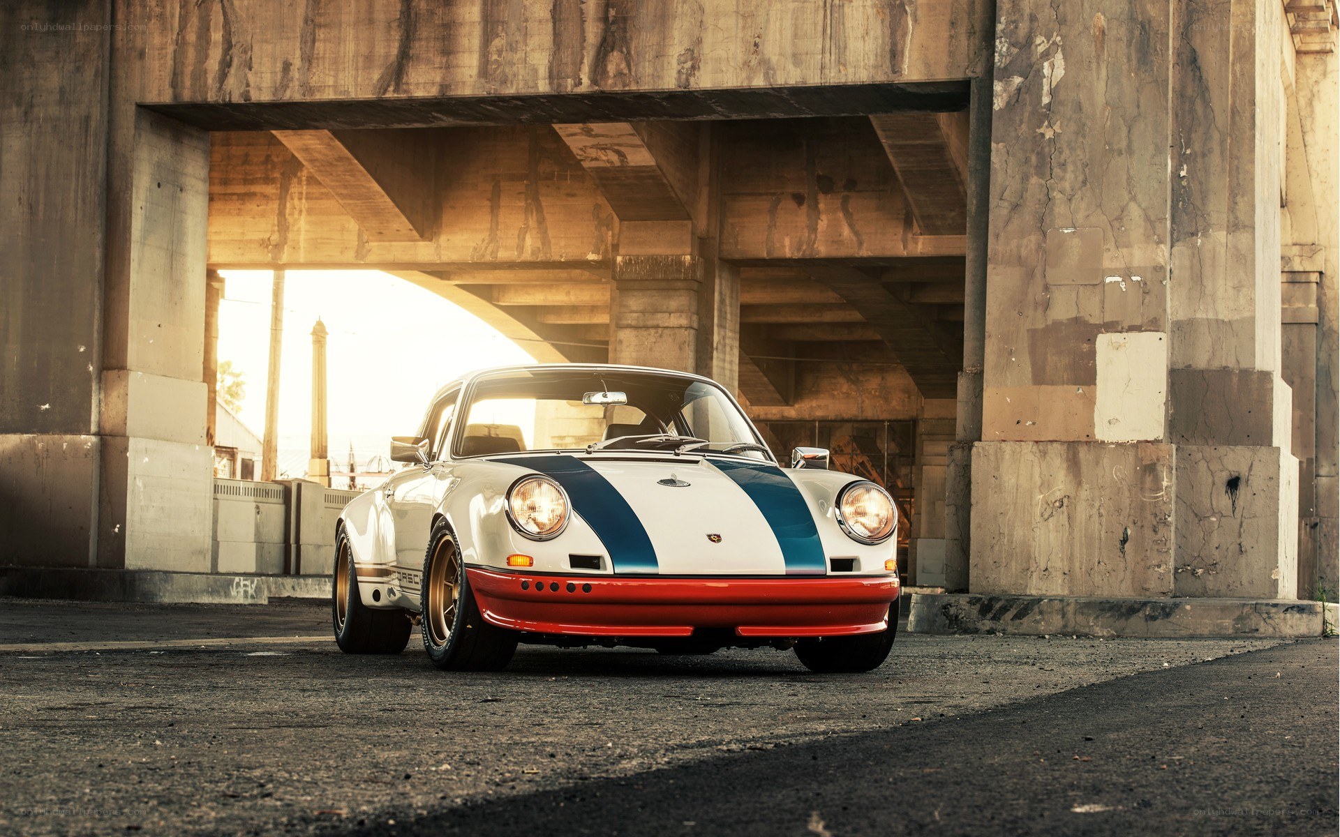 Porsche under a bridge