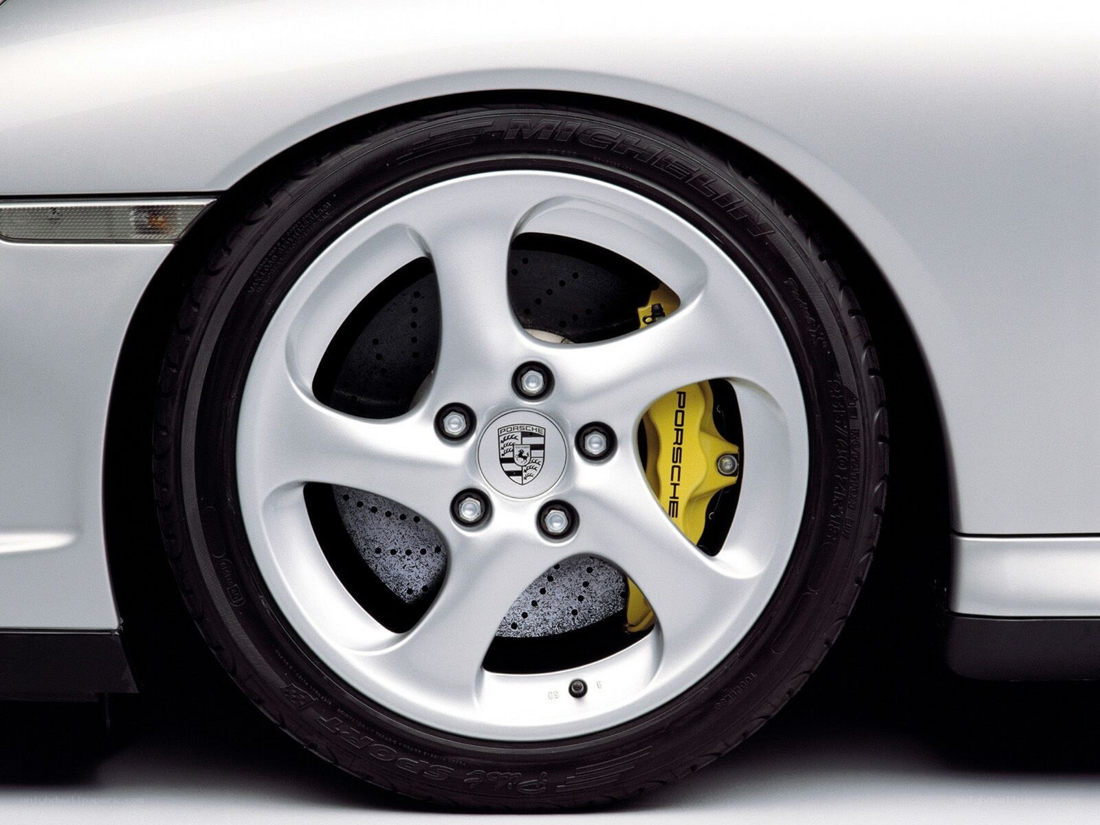 Porsche wheel with yellow calipers