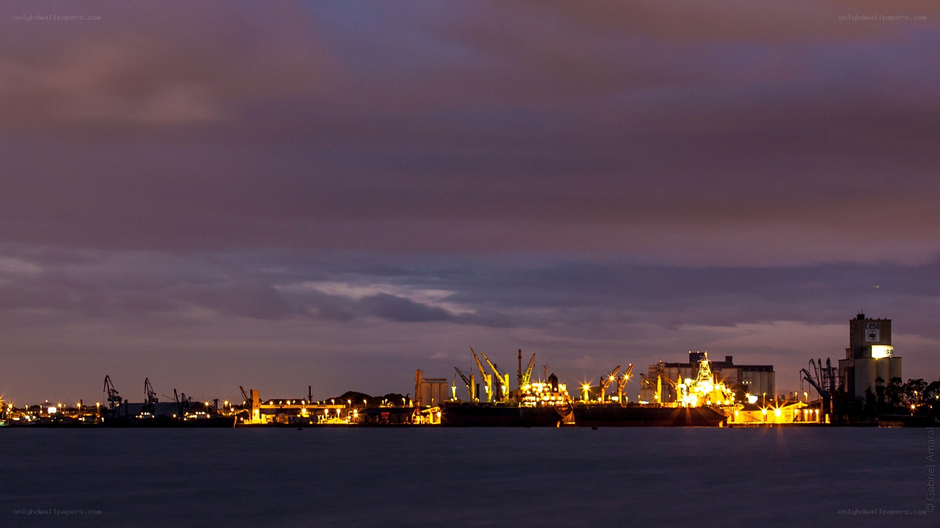 Port at dusk with cranes