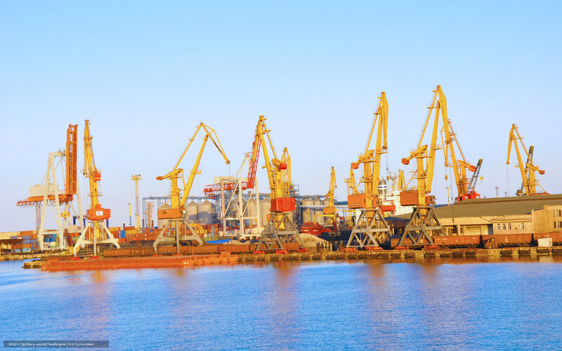 Port with cranes at sunset
