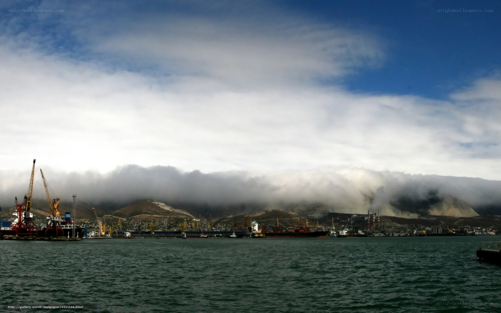Port with fog-covered mountains