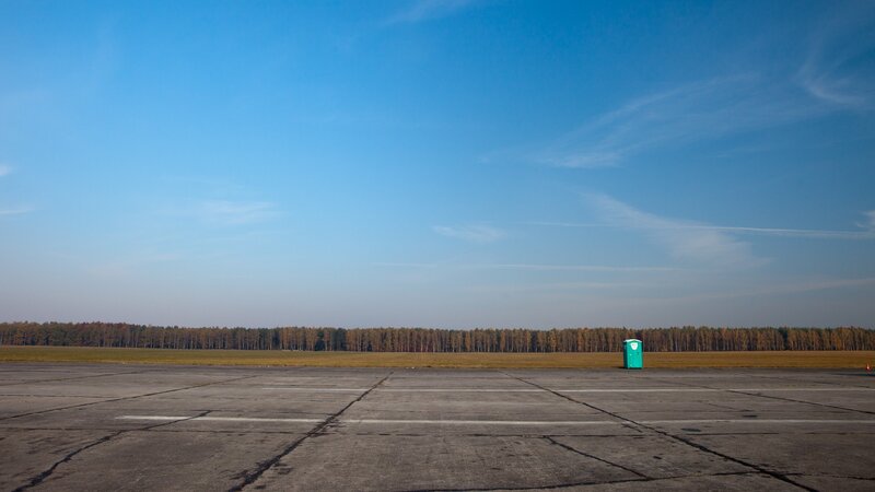Portable Toilet on Tarmac — Blue