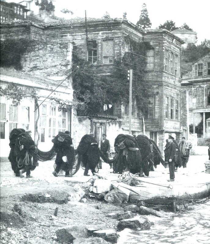 Porters carrying goods in old town