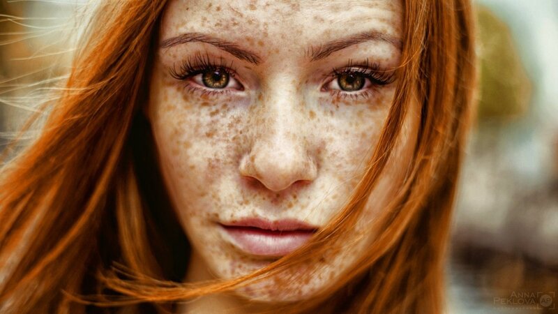 portrait of a freckled woman