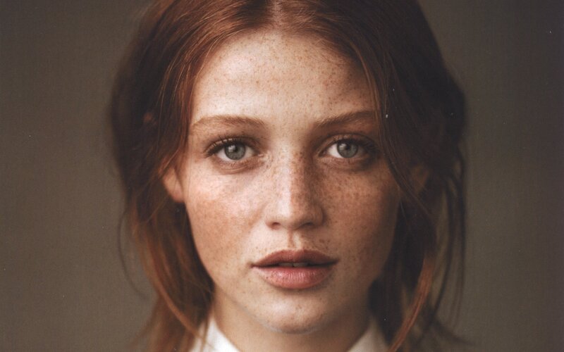 portrait of a freckled woman