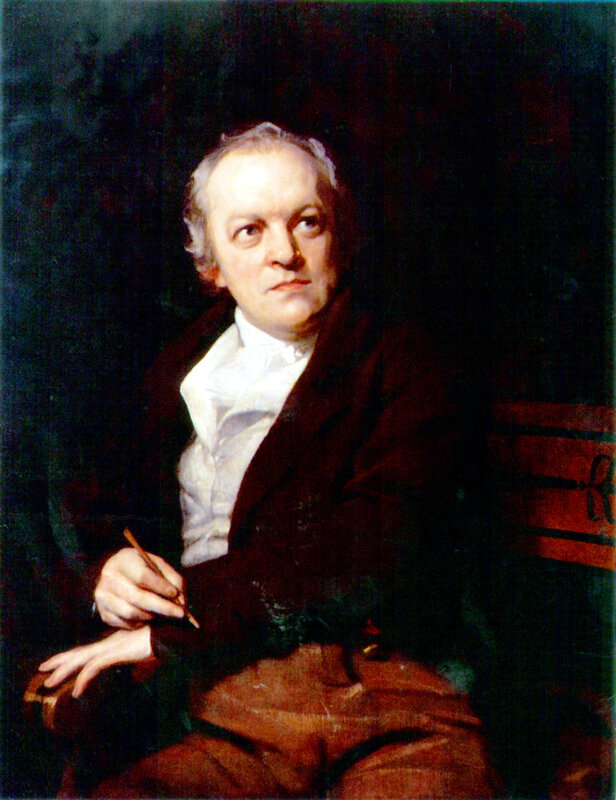 Portrait of a man holding a pen