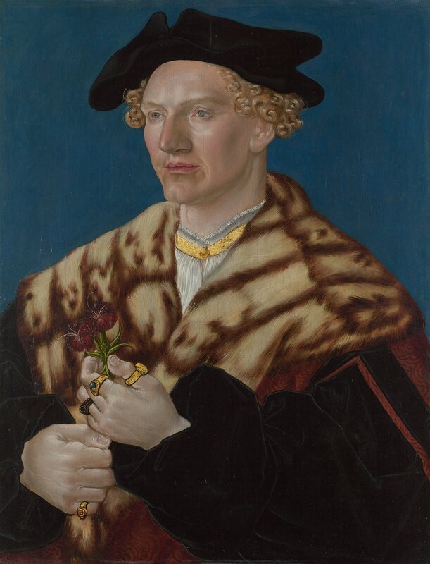 Portrait of a man with flower