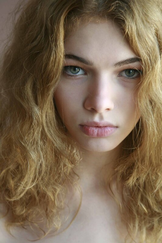 portrait of a woman with curly hair