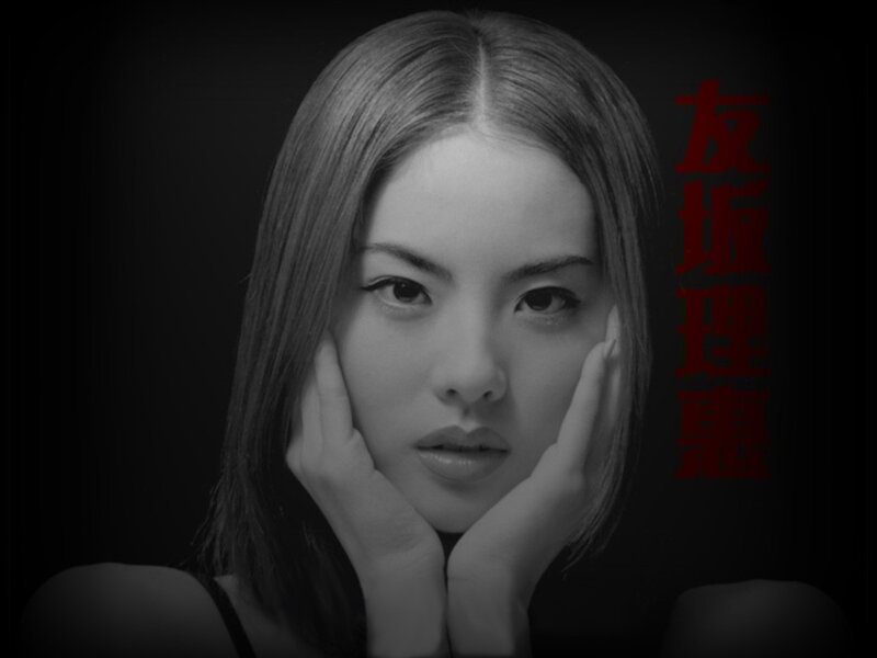 Portrait of a woman with hands on face