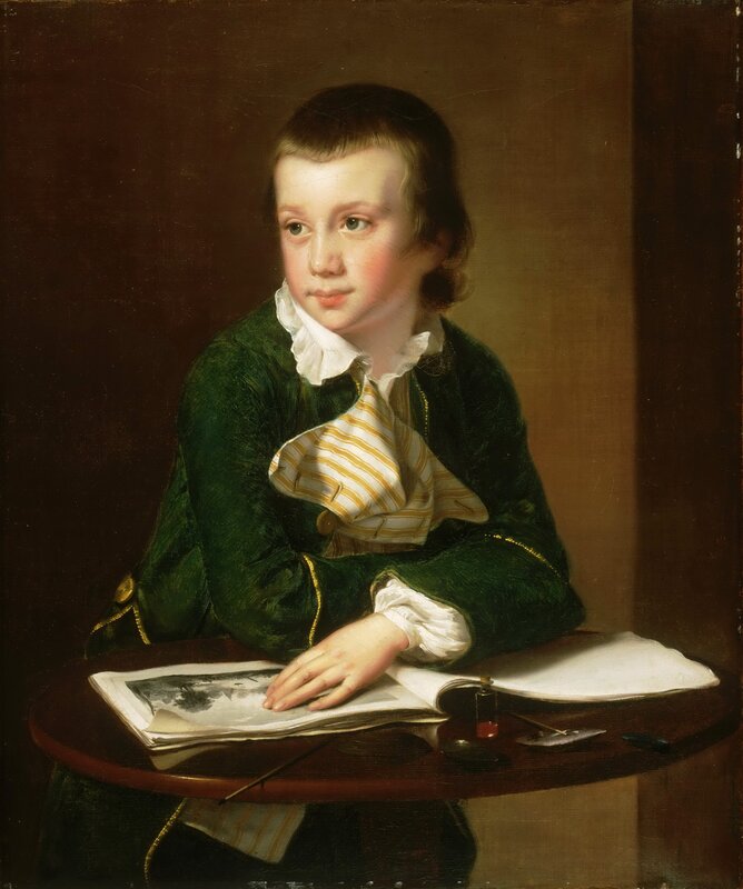 Portrait of a young boy at a table