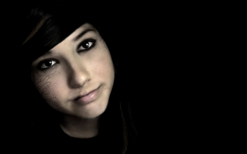 portrait of a young woman with cracked skin