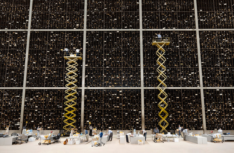 Postal workers in a sorting facility