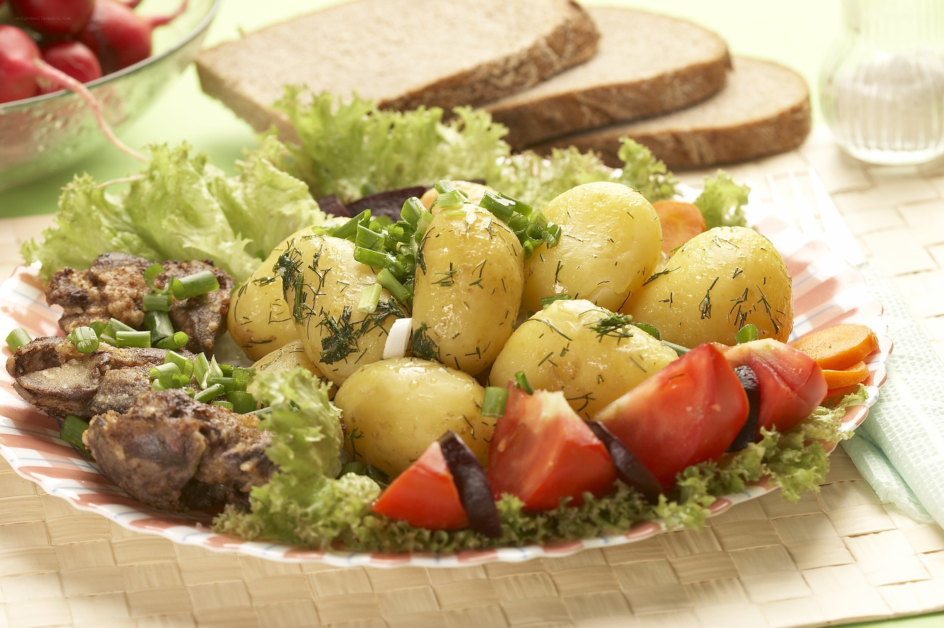 Potato salad with vegetables and bread